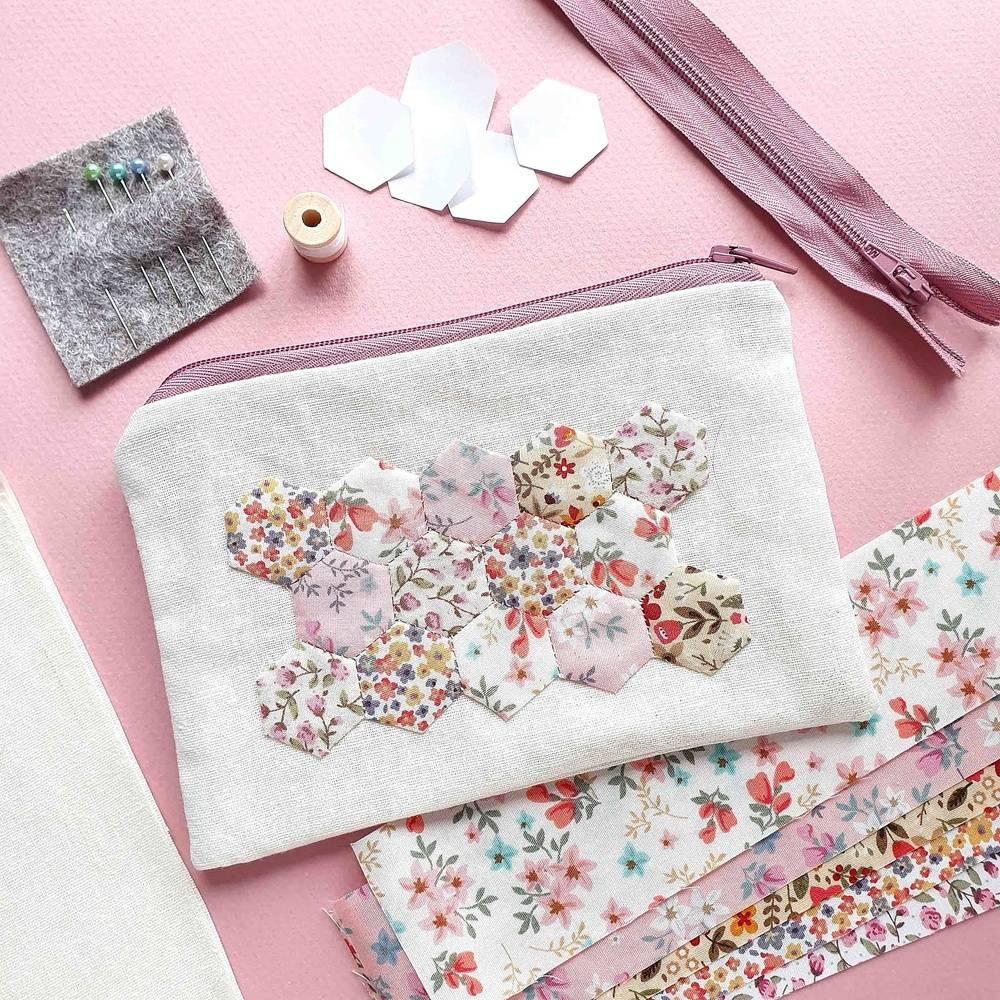 A handmade pencil case, with floral, hexagonal shapes